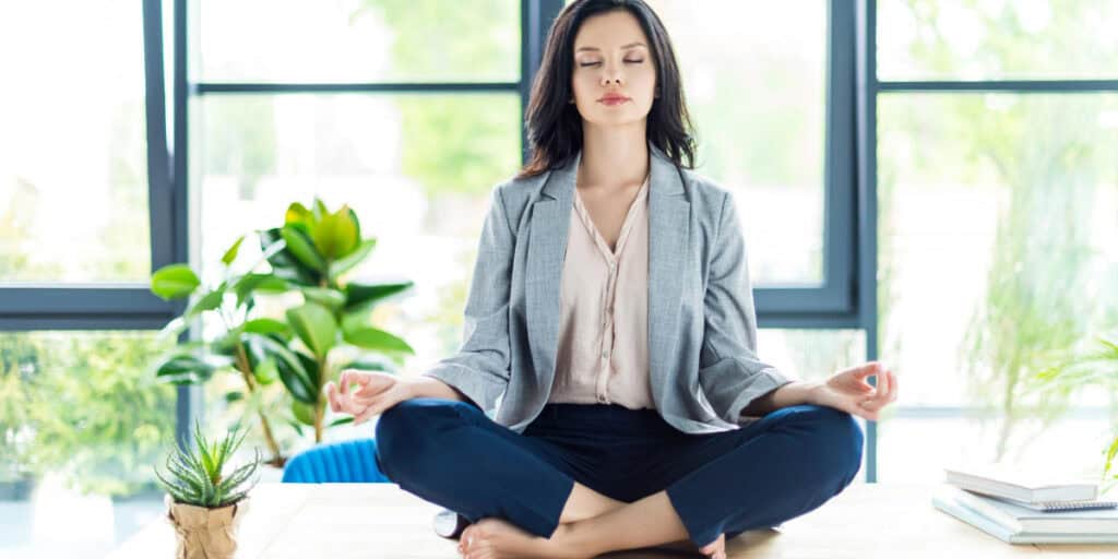 Meditating on a desk