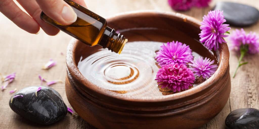 aromatherapy oil tipped into water