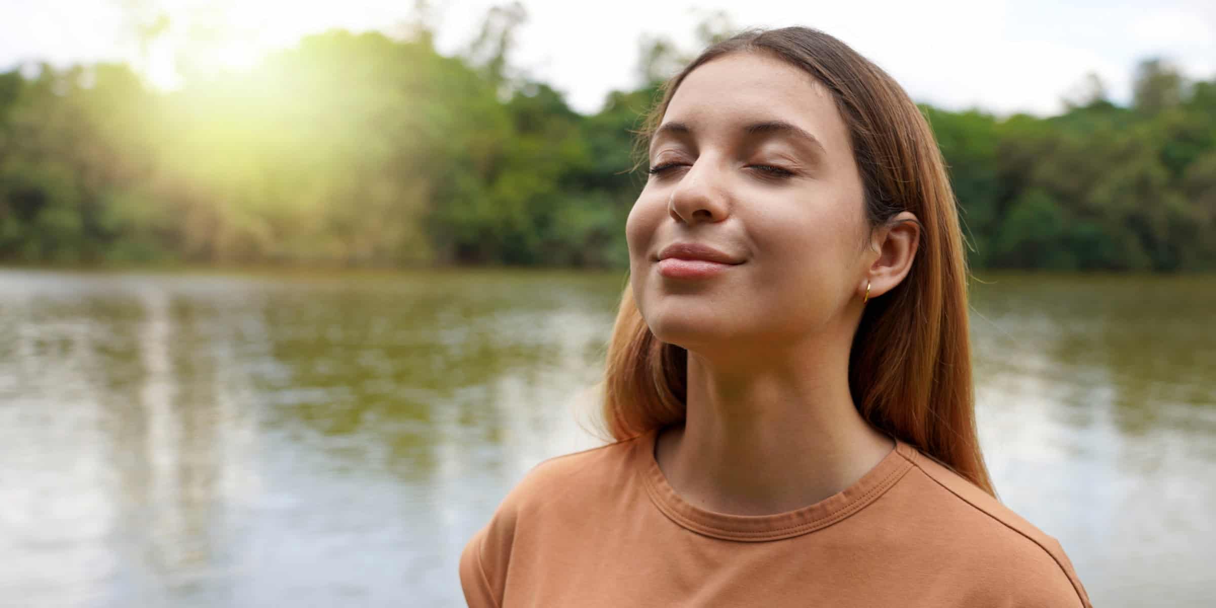 woman outside inhaling