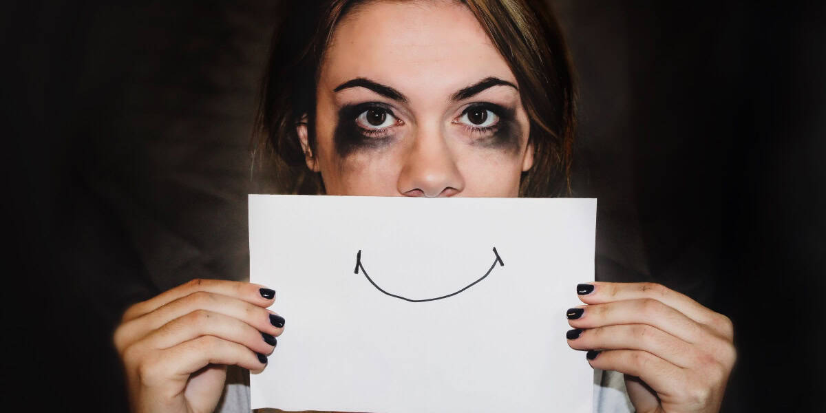 unhappy girl with drawn smile