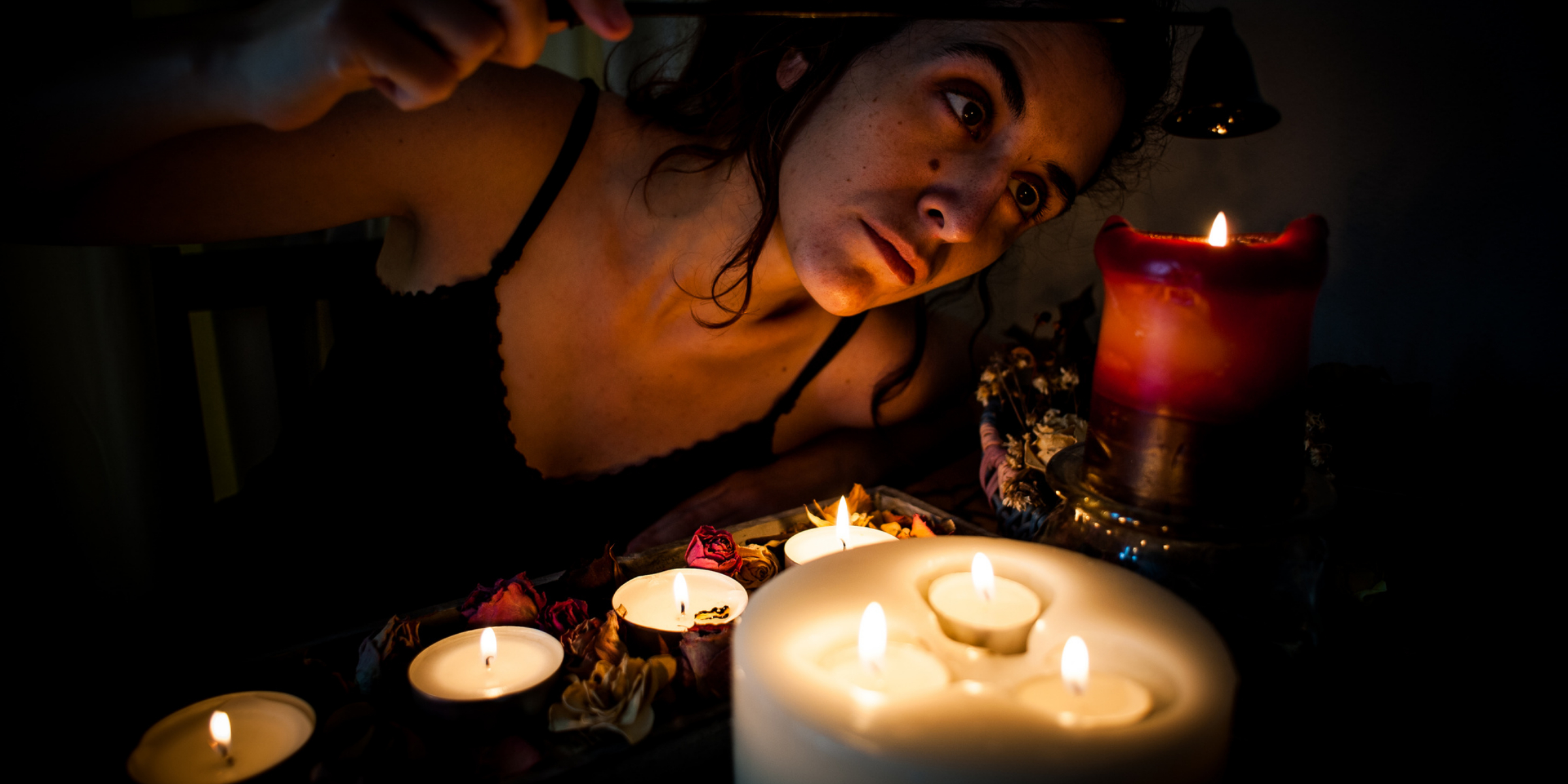 woman lighting candles