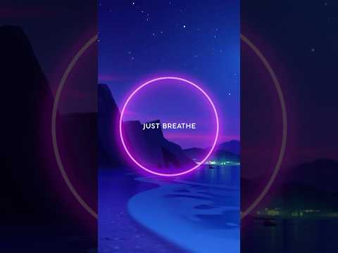 A neon pink circle with the words "JUST BREATHE" overlays a digital illustration of a calm nighttime beach with mountains and stars in the background.
