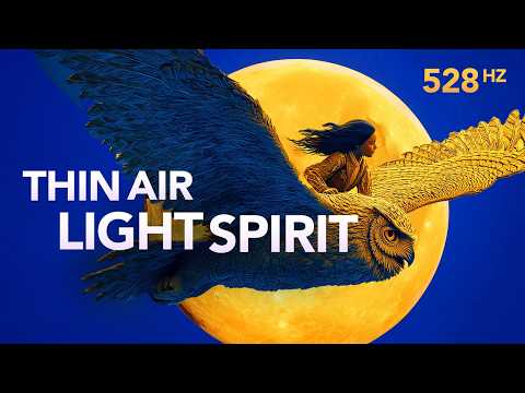 A person rides a large blue and gold owl flying in front of a full yellow moon, with text reading "Thin Air Light Spirit" and "528 Hz" on a blue background.