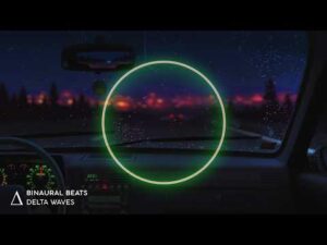 View from inside a car at night with a glowing green circle in the centre, raindrops on the windscreen, and blurred city lights in the background. Text reads “Binaural Beats Delta Waves.”.