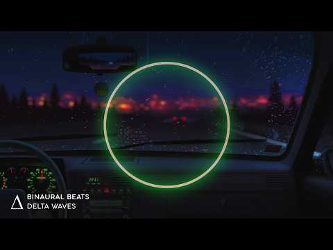 View from inside a car at night with a glowing green circle in the centre, raindrops on the windscreen, and blurred city lights in the background. Text reads “Binaural Beats Delta Waves.”.